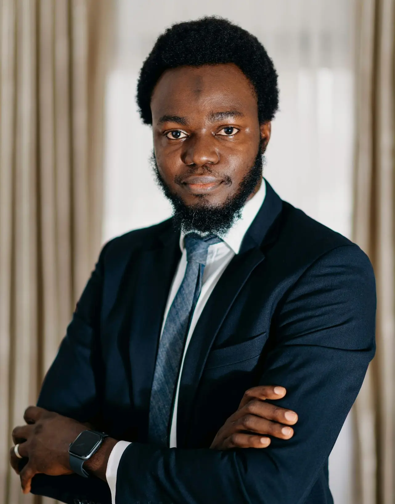 a man in a suit and tie posing for a picture